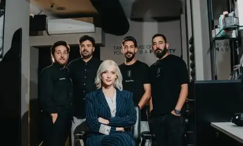 Staff members of intense barbershop in Amman