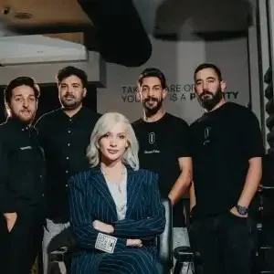 Staff members of intense barbershop in Amman